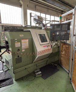 OKUMA LT 10M Horizontal Turning Machine Equipped with Bar Loader